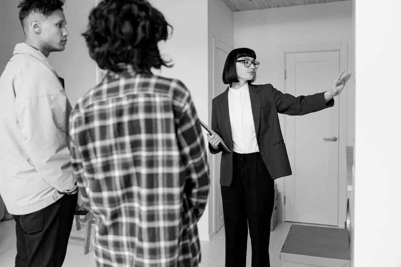 image of a real estate agent visiting a property with clients